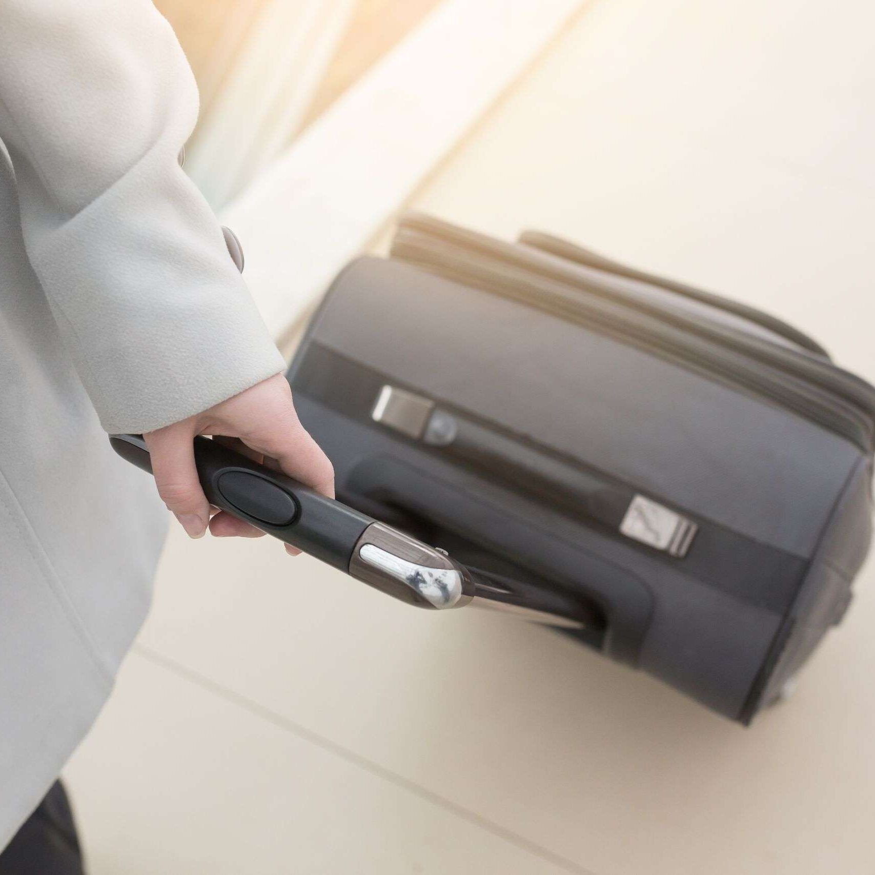 Business,Woman,Going,With,Luggage,Or,Bag,On,Her,Business